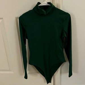 Green long-sleeved bodysuit, never worn. Size M